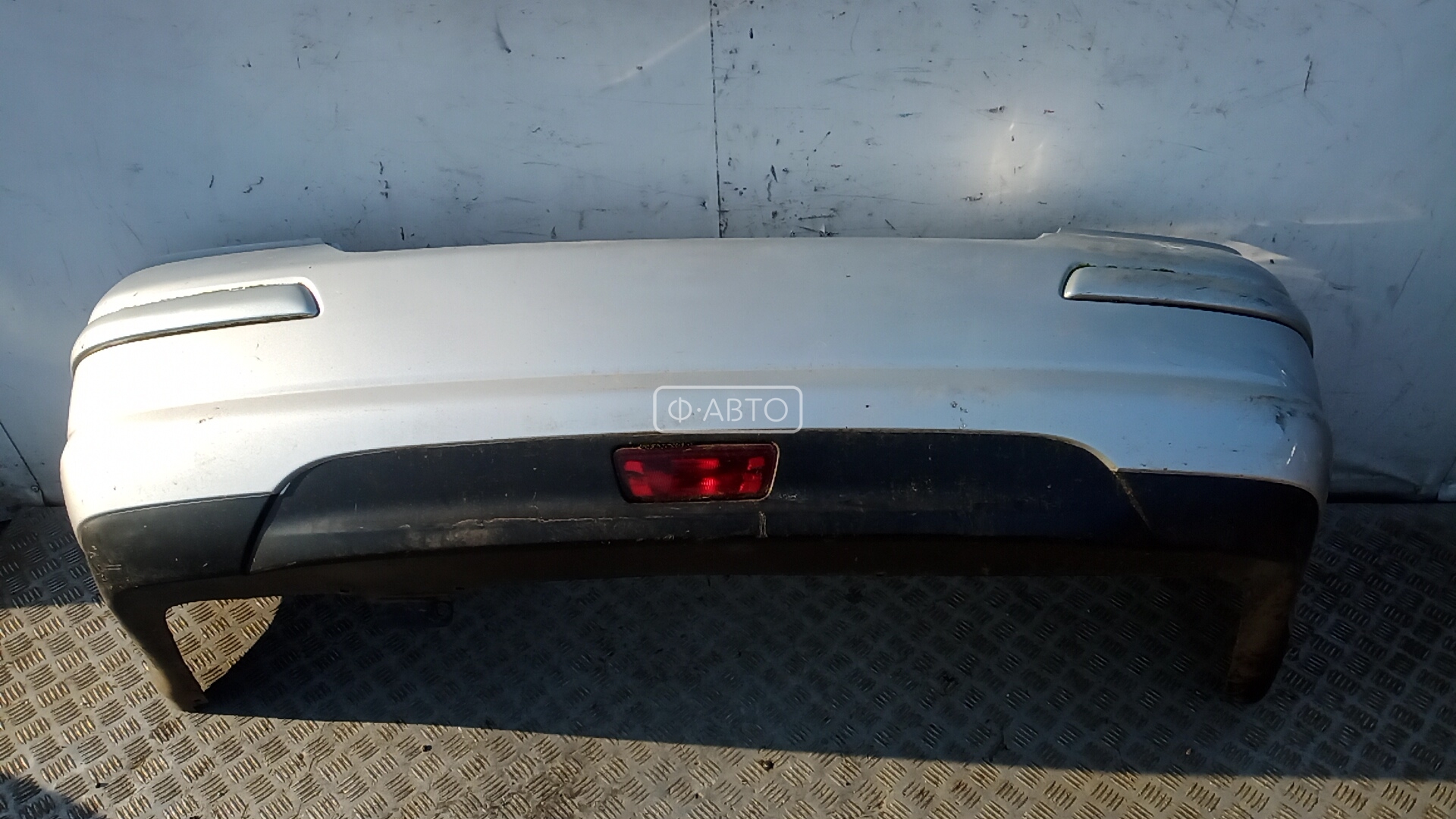 Бампер - Nissan Tiida (2004-2014)
